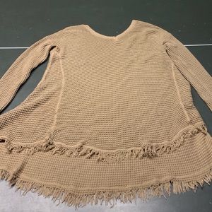 Tan tunic with fringe trim